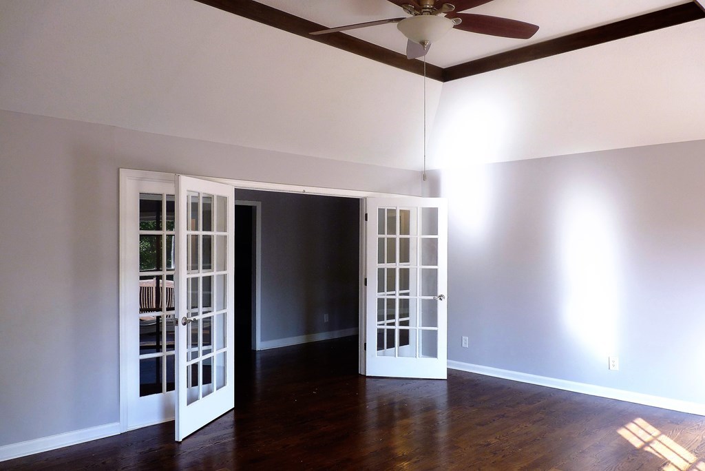 316 Lower Simmons Road Macon, GA 31220 - Photo 17 of 34 a view of an empty room with wooden floor and a window