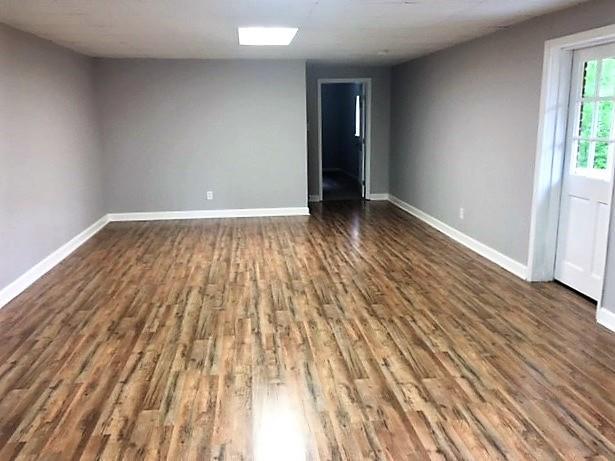 316 Lower Simmons Road Macon, GA 31220 - Photo 23 of 34 wooden floor in an empty room with a window
