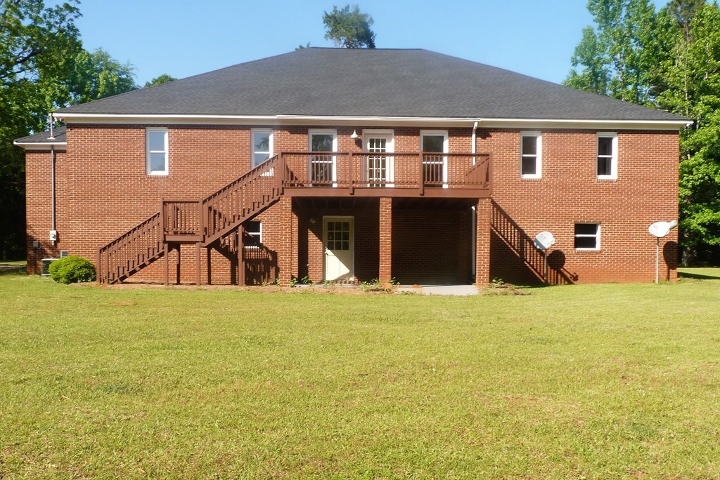 316 Lower Simmons Road Macon, GA 31220 - Photo 30 of 34 a front view of a house with a yard