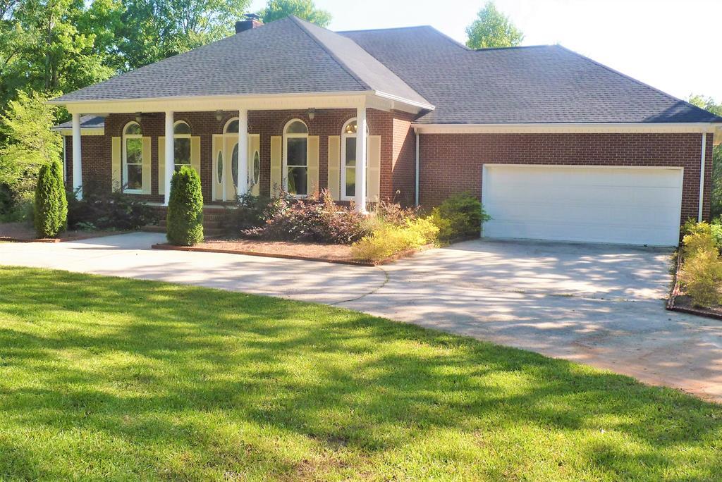 316 Lower Simmons Road Macon, GA 31220 - Photo 31 of 34 a front view of a house with a yard