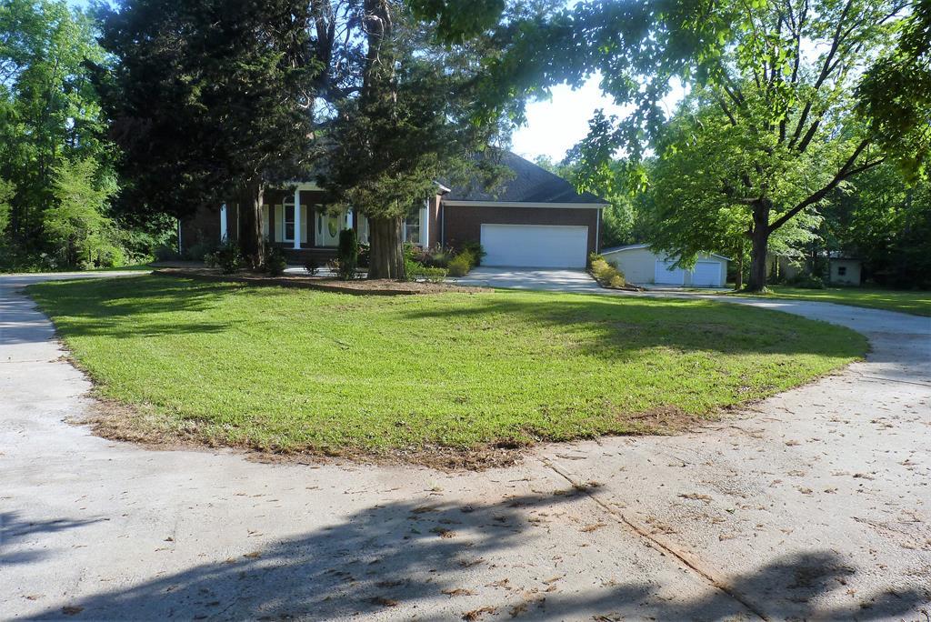316 Lower Simmons Road Macon, GA 31220 - Photo 32 of 34 a front view of a house with garden