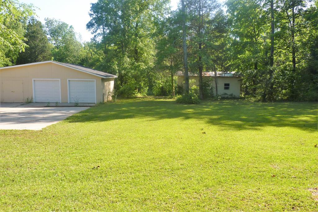 316 Lower Simmons Road Macon, GA 31220 - Photo 34 of 34 a view of a house with a yard and a large tree