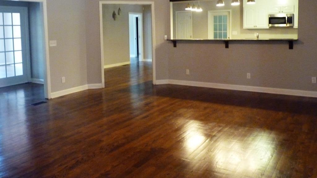 316 Lower Simmons Road Macon, GA 31220 - Photo 5 of 34 a view of a room with wooden floor and two window