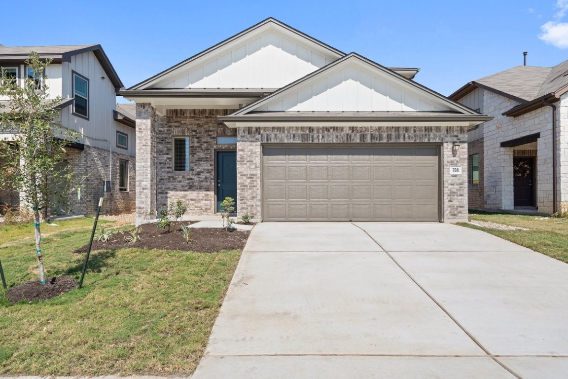 708 Backstays Loop Kyle, TX 78640 - Photo 1 of 1 a front view of a house with garden