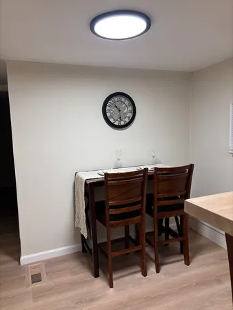 a view of a livingroom with furniture and wooden floor