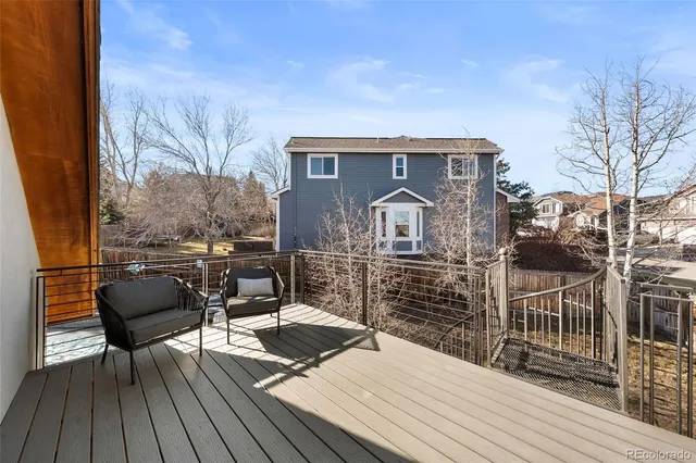 a living room with furniture and a flat tv screen