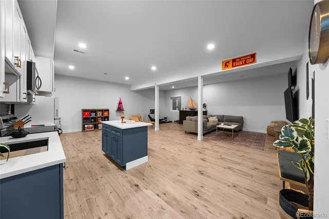 a kitchen with kitchen island granite countertop lots of counter top space cabinets and stainless steel appliances