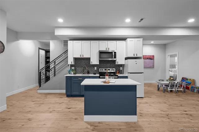 a kitchen with a sink and cabinets