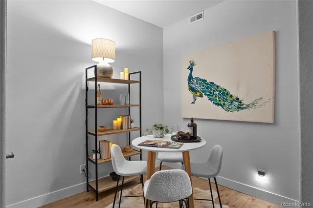 a spacious bedroom with bed and a flat screen tv