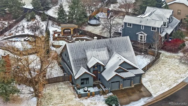 an aerial view of a house with outdoor space