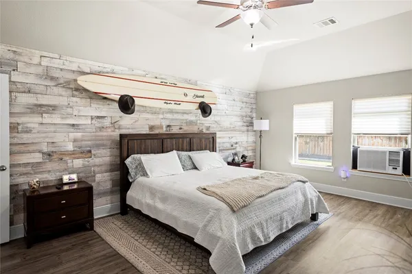 a bedroom with a bed and a fireplace