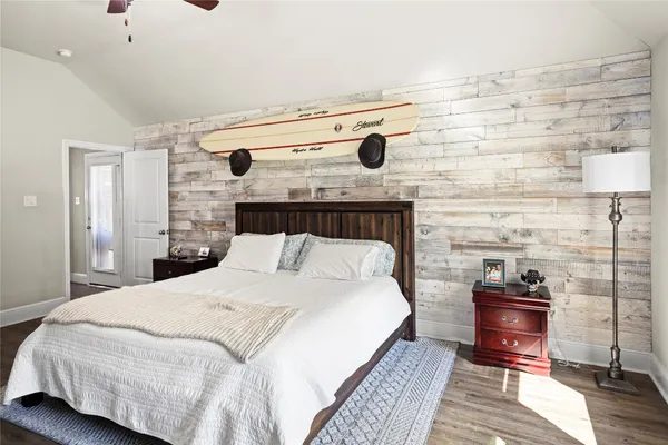 a bed sitting in a bedroom and table