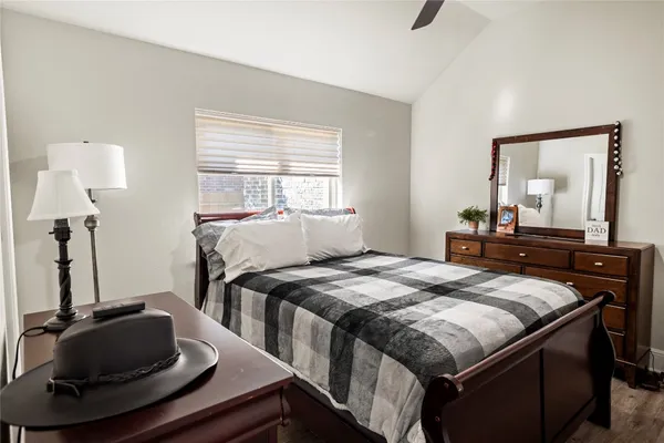 a bedroom with a bed and a piano