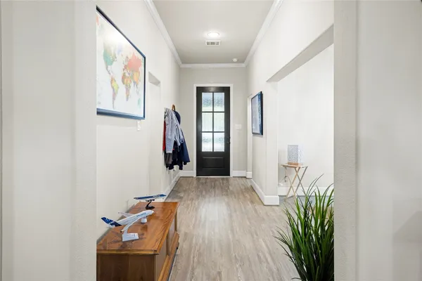a view of entryway with wooden floor