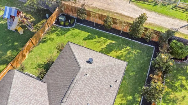 an aerial view of a house with swimming pool