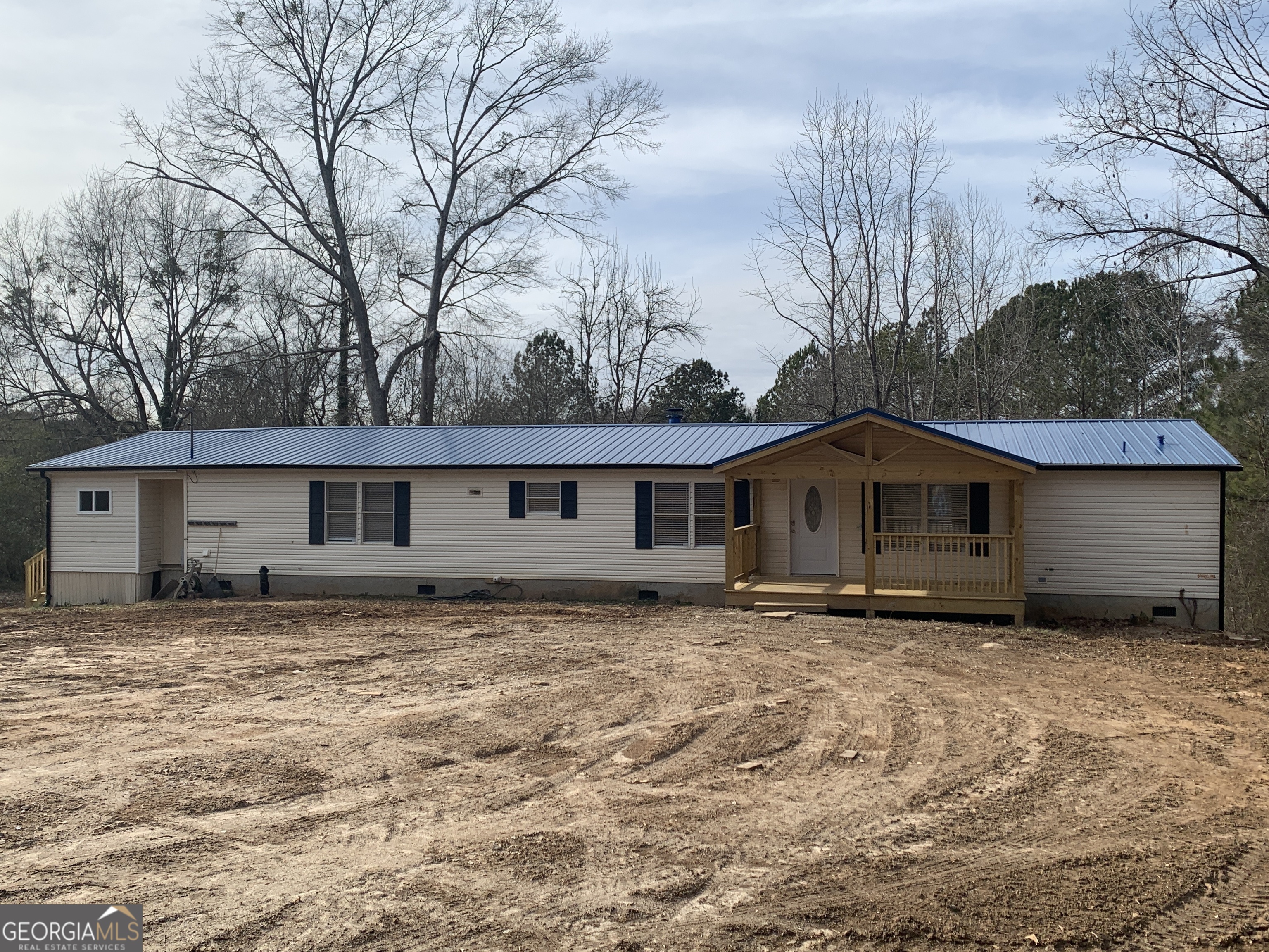 579 Swan Lake Road Stockbridge, GA 30281 - Photo 1 of 1 a house that has a tree in front of it