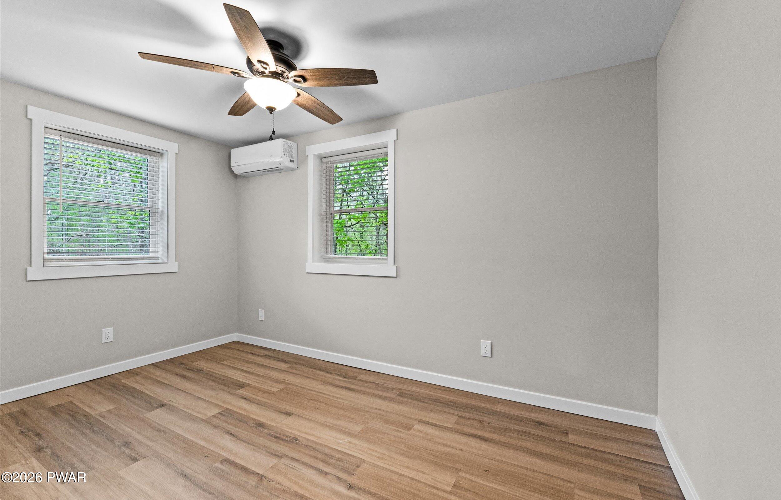 9 High Point Court Lake Ariel, PA 18436 - Photo 23 of 40 a view of an empty room with wooden floor and a window