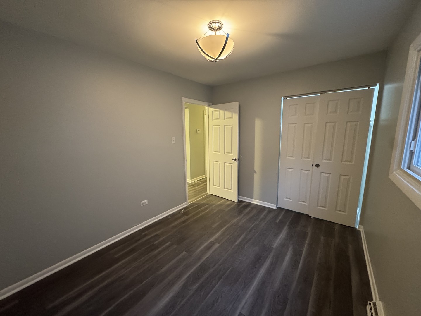 1447 West 114th Place Chicago, IL 60643 - Photo 11 of 21 wooden floor in an empty room with a window