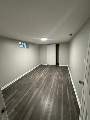 a view of wooden floor in an empty room