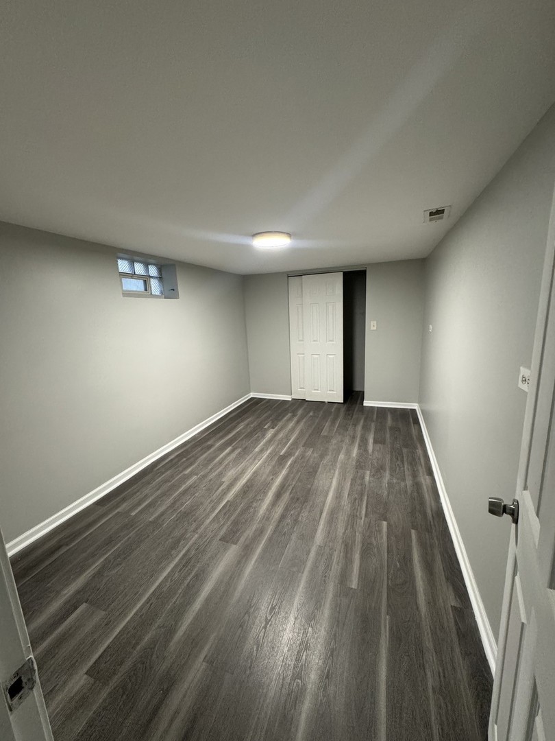 1447 West 114th Place Chicago, IL 60643 - Photo 18 of 21 a view of wooden floor in an empty room