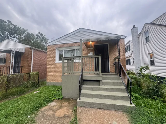 a front view of house with stairs