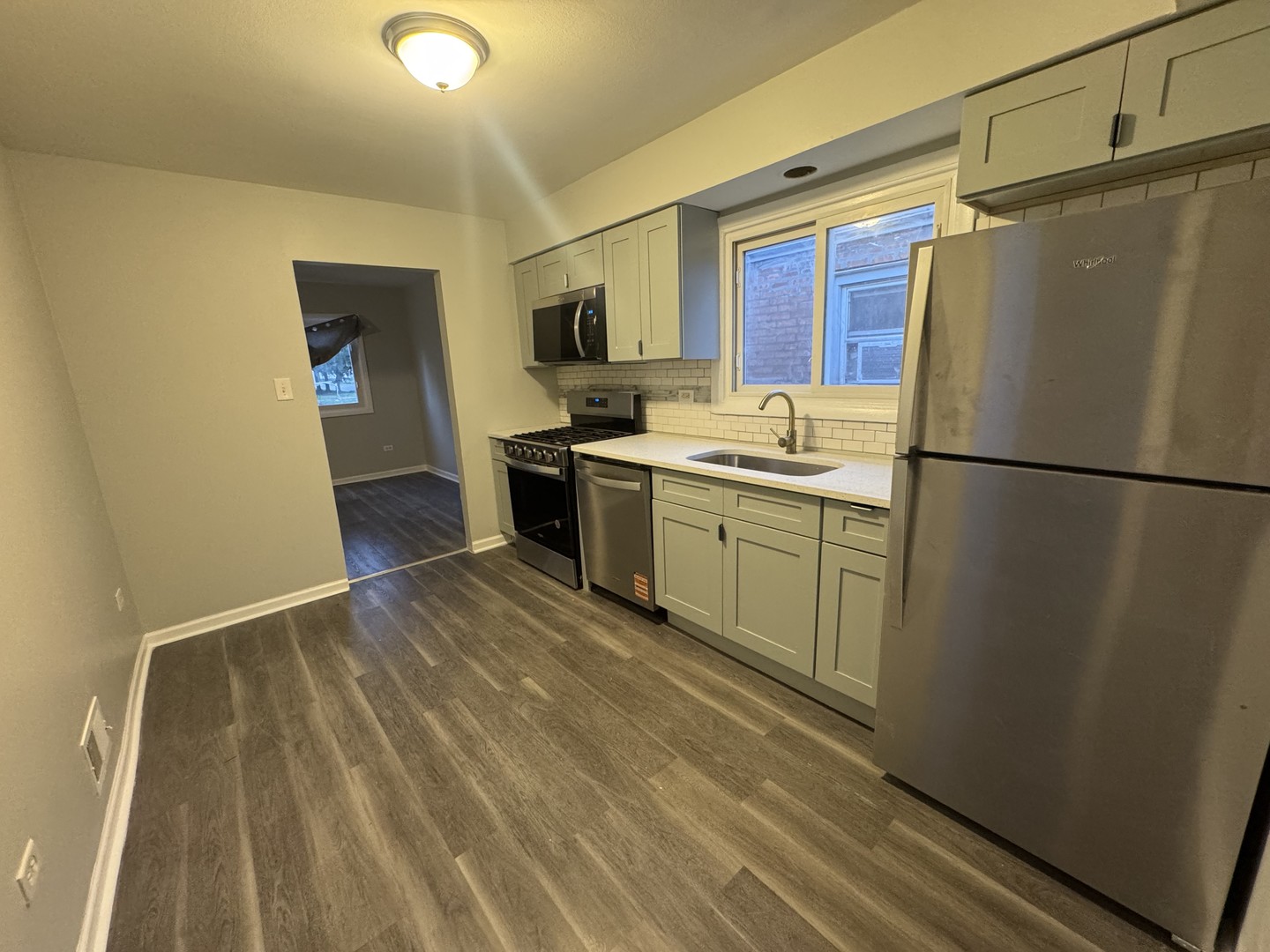 1447 West 114th Place Chicago, IL 60643 - Photo 5 of 21 a kitchen with stainless steel appliances a refrigerator sink and cabinets