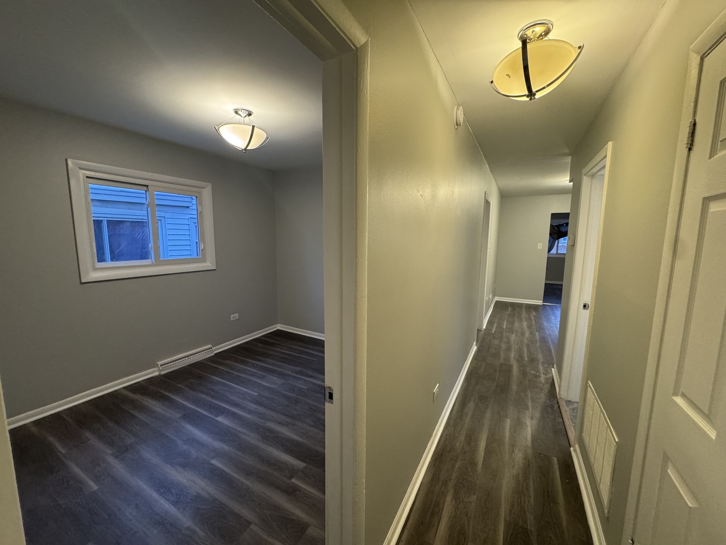 1447 West 114th Place Chicago, IL 60643 - Photo 7 of 21 a view of a hallway with wooden floor
