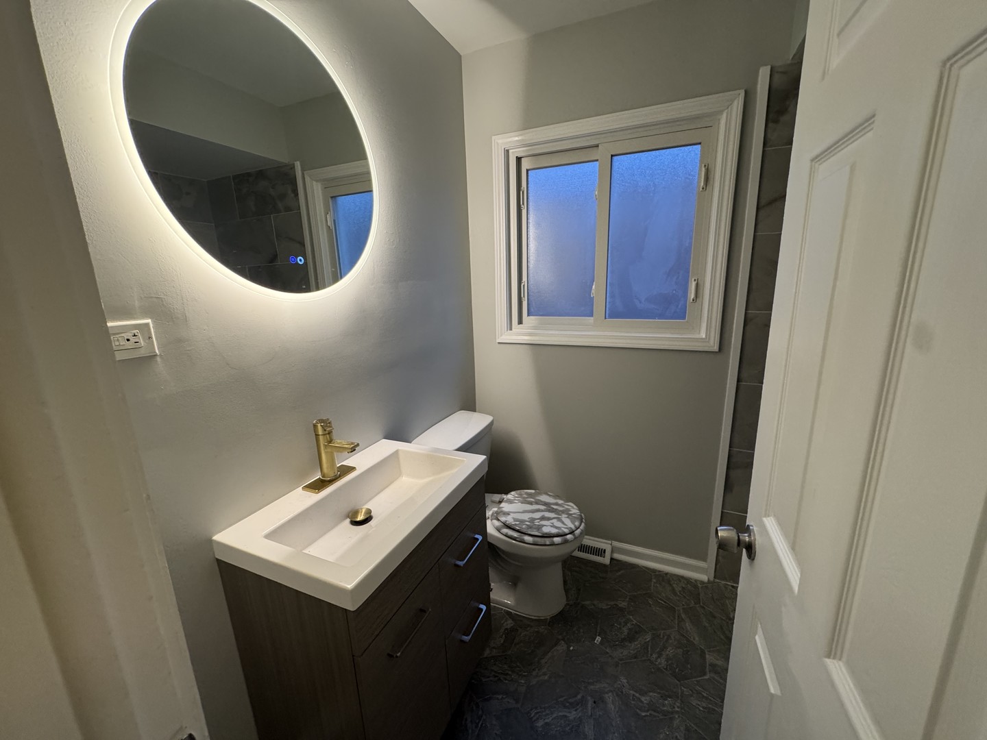 1447 West 114th Place Chicago, IL 60643 - Photo 10 of 21 a bathroom with a sink toilet and mirror