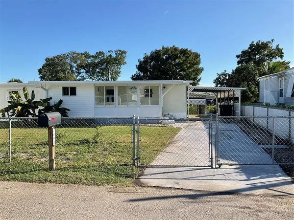a view of house with a swimming pool