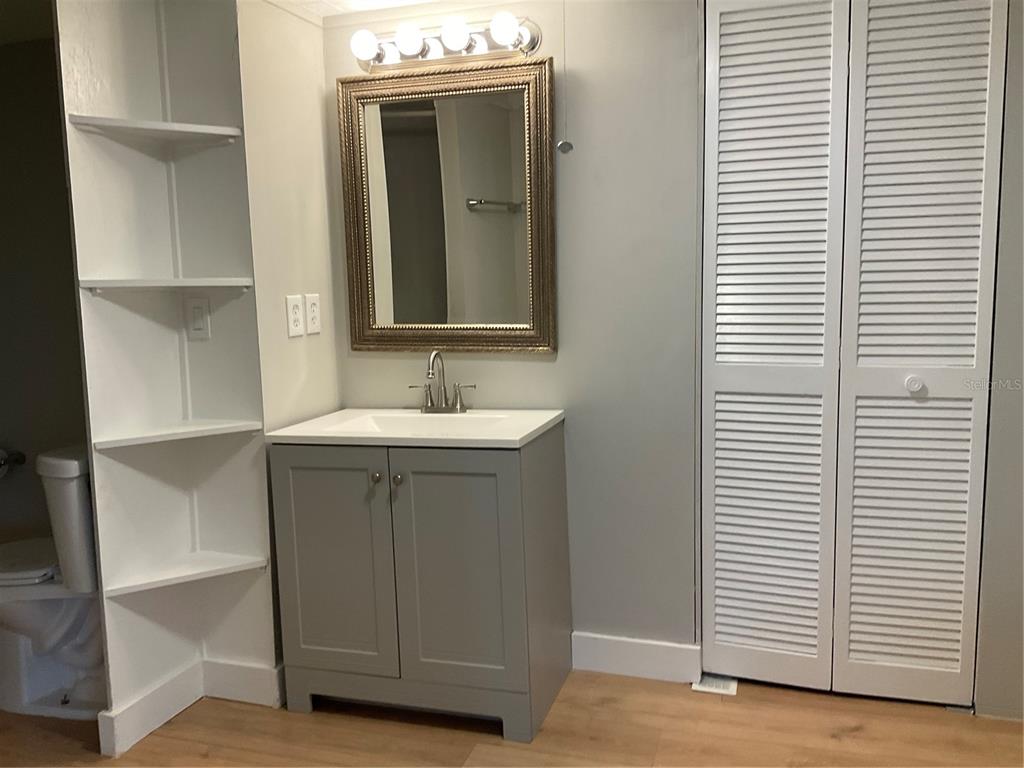 1602 Chobee Street Okeechobee, FL 34974 - Photo 11 of 20 a bathroom with a sink and a mirror