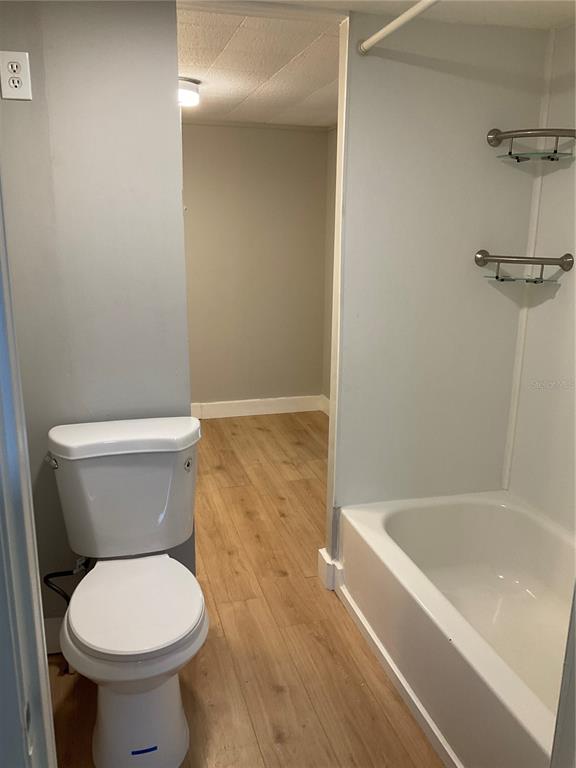 1602 Chobee Street Okeechobee, FL 34974 - Photo 12 of 20 a white toilet sitting next to a bath tub