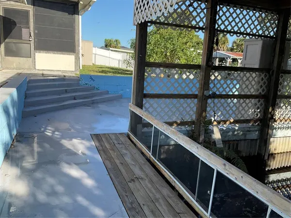 a view of balcony with wooden floor