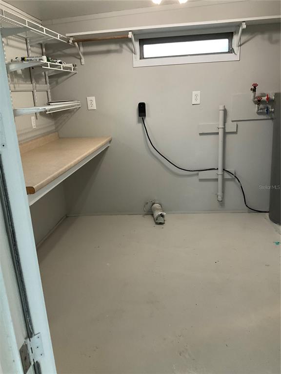 1602 Chobee Street Okeechobee, FL 34974 - Photo 20 of 20 a view of a room with racks on the wall