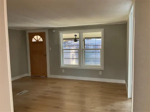 a view of an empty room with a window