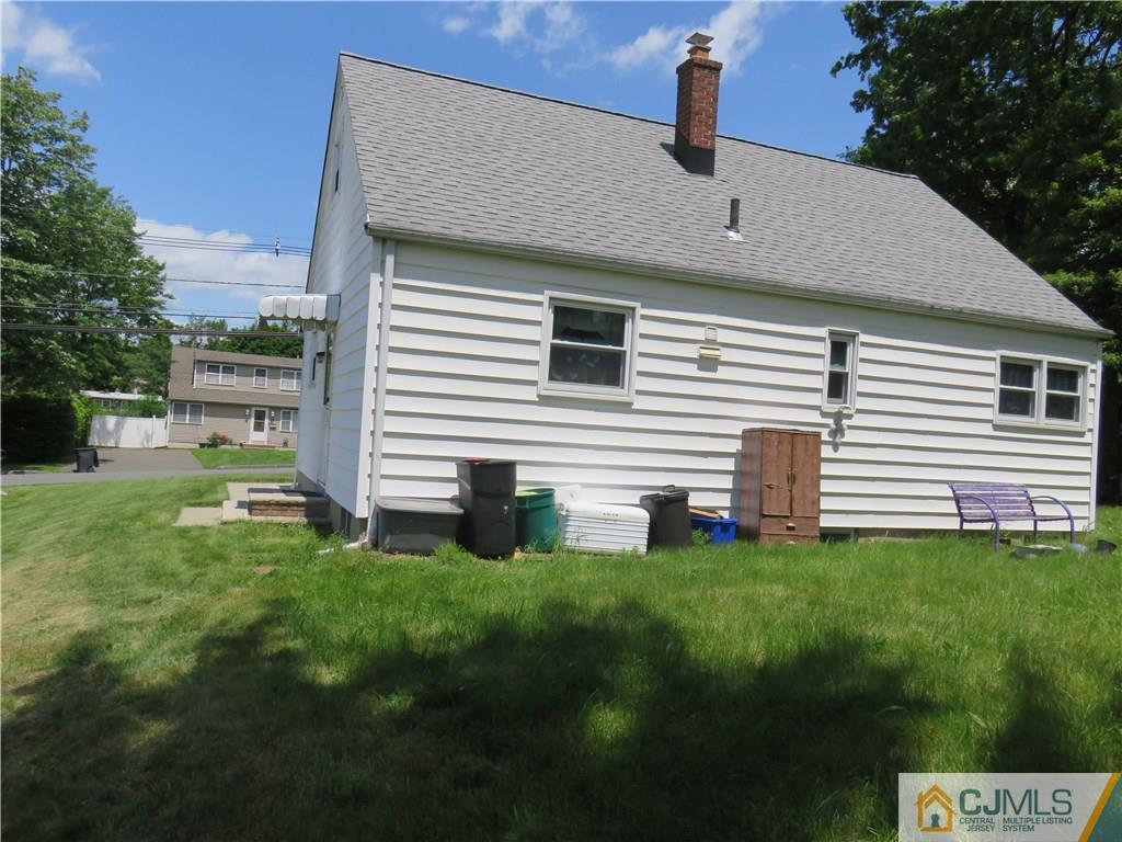 12 Pennington Road New Brunswick, NJ 08901 - Photo 3 of 10 a front view of a house with a garden