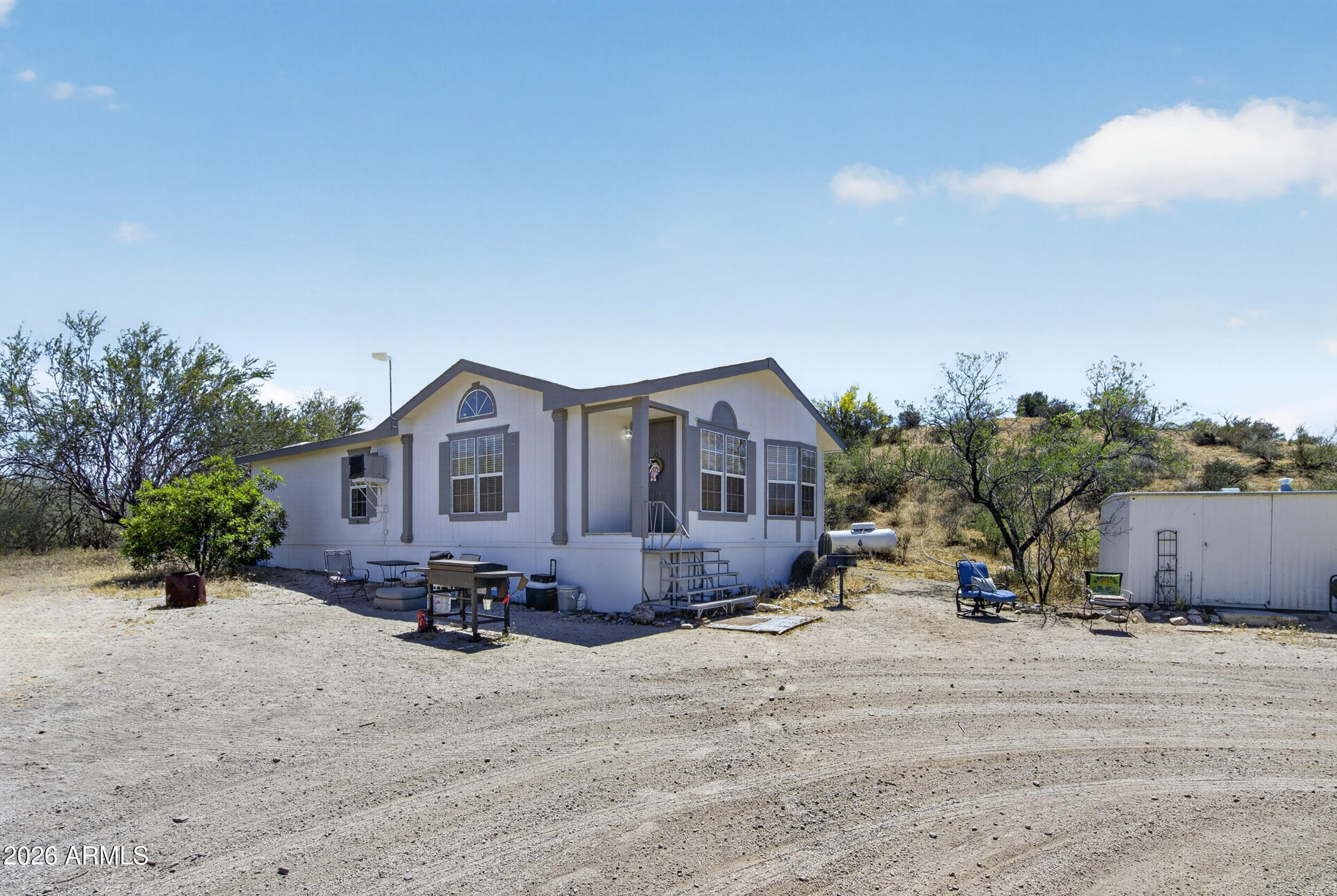 38809 East Spotted Horse Road Florence, AZ 85132 - Photo 2 of 40 a view of a house with a yard