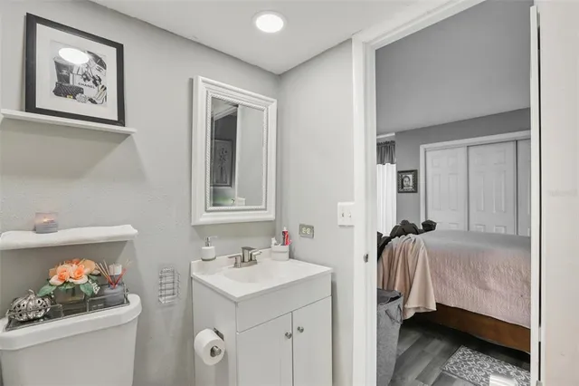 a en suite bathroom with a sink and a mirror