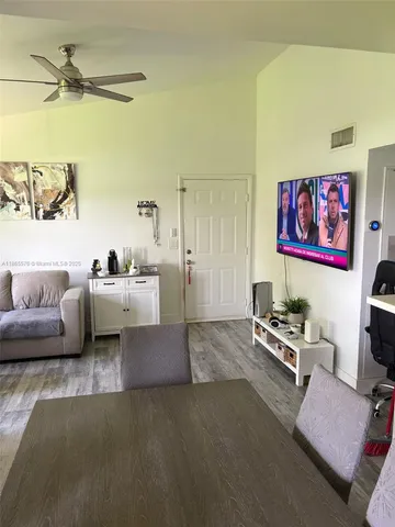 a living room with furniture and a rug