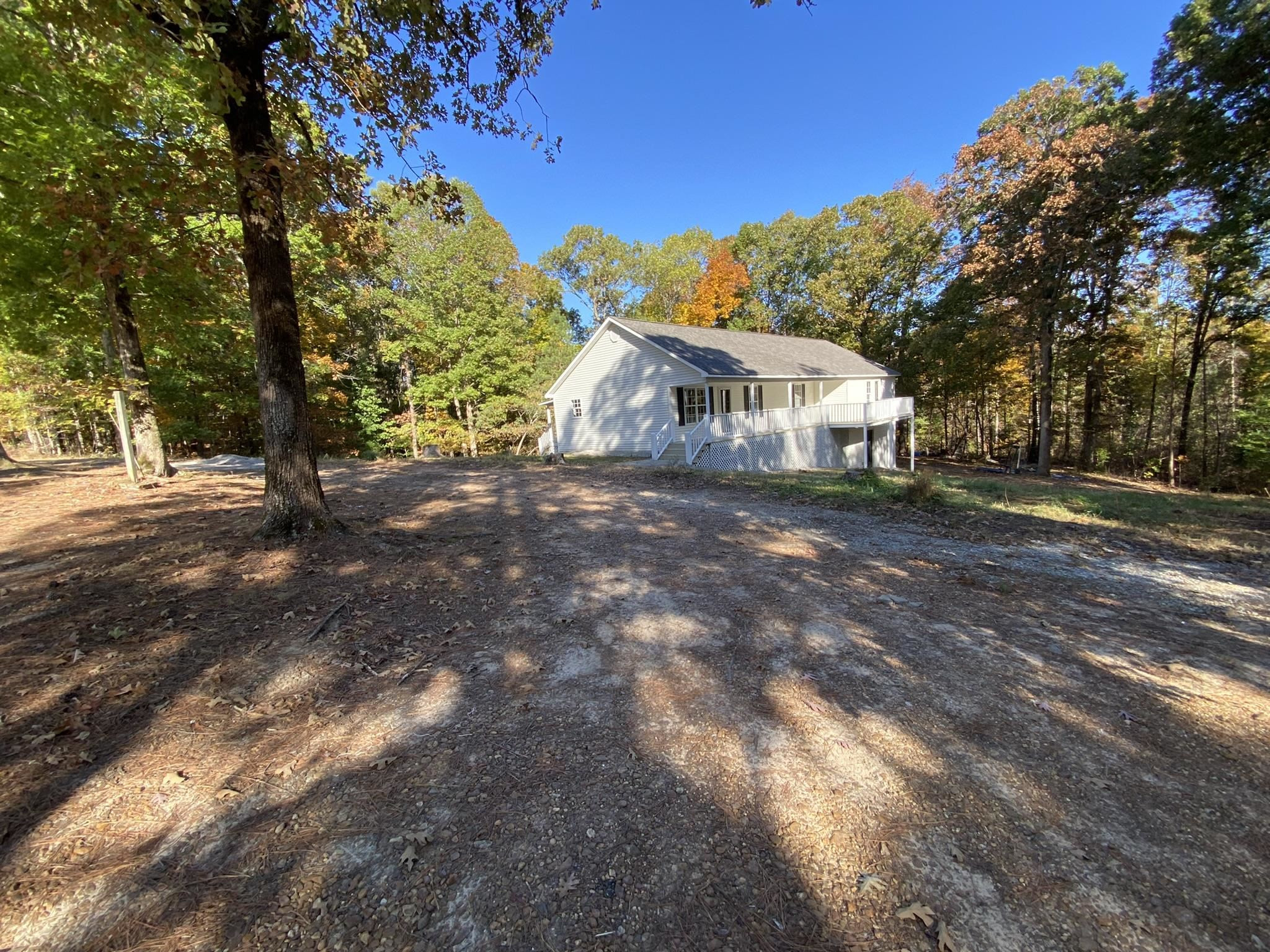 7235 Sweet Lips Road Enville, TN 38332 - Photo 23 of 26 a view of an house with backyard space and garden
