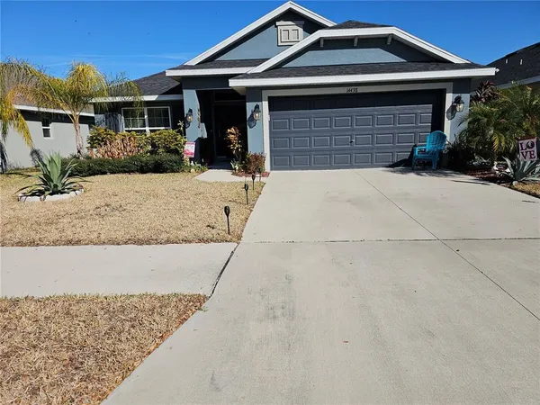a front view of a house with garage