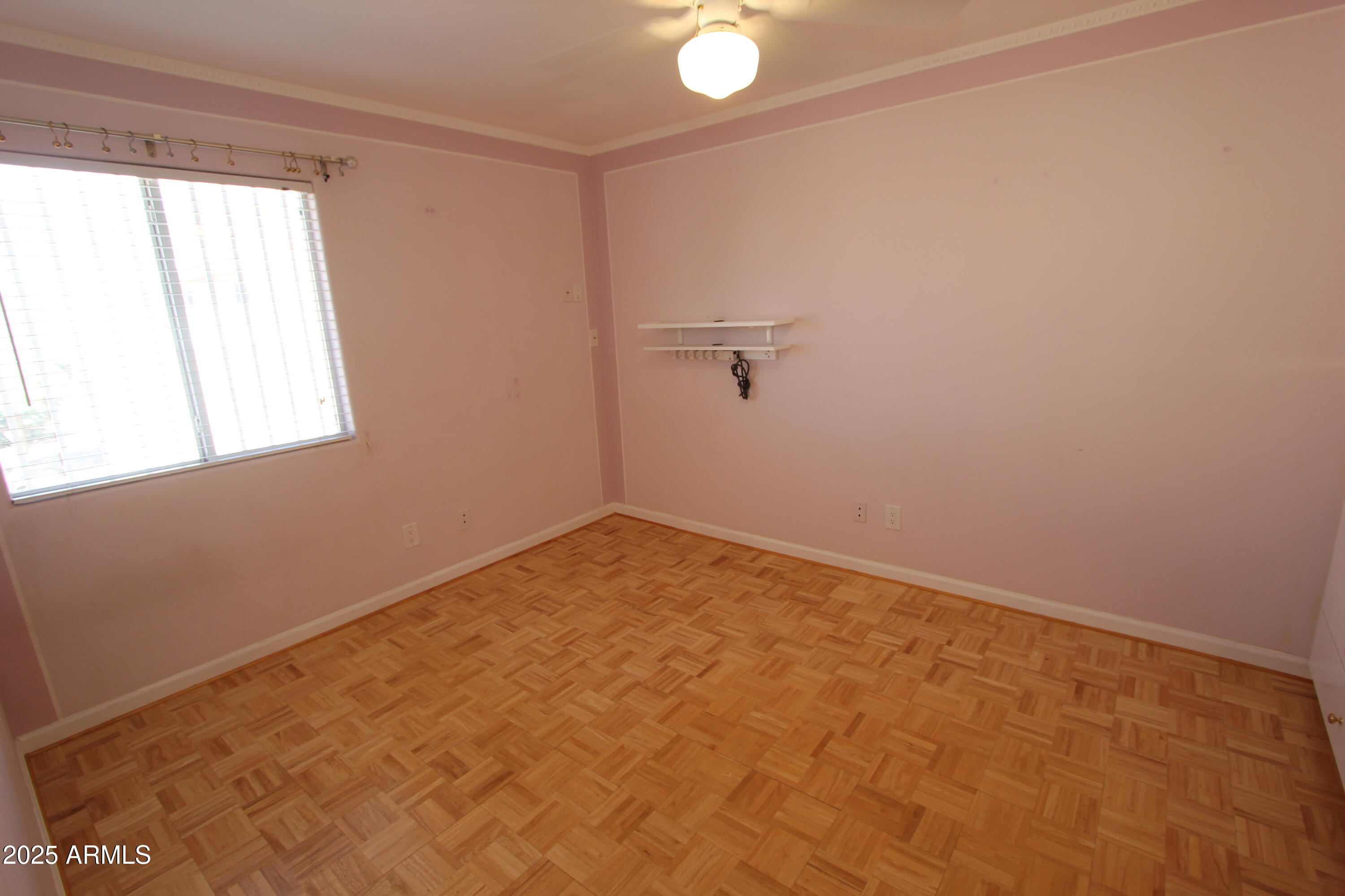 10411 North 11th Avenue, Unit 3 Phoenix, AZ 85021 - Photo 15 of 23 an empty room with a window