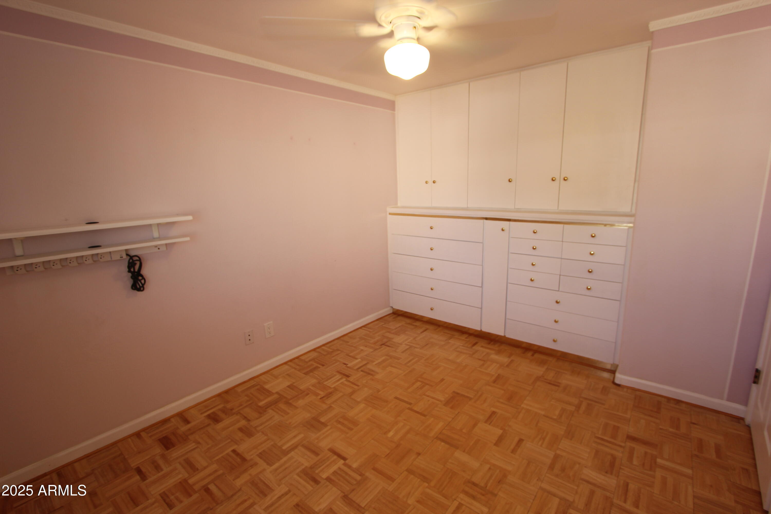 10411 North 11th Avenue, Unit 3 Phoenix, AZ 85021 - Photo 16 of 23 a view of a room with cabinets and wooden floor