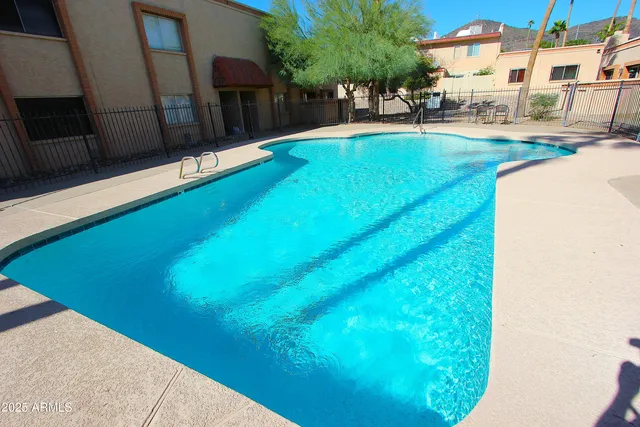 a view of swimming pool with a yard