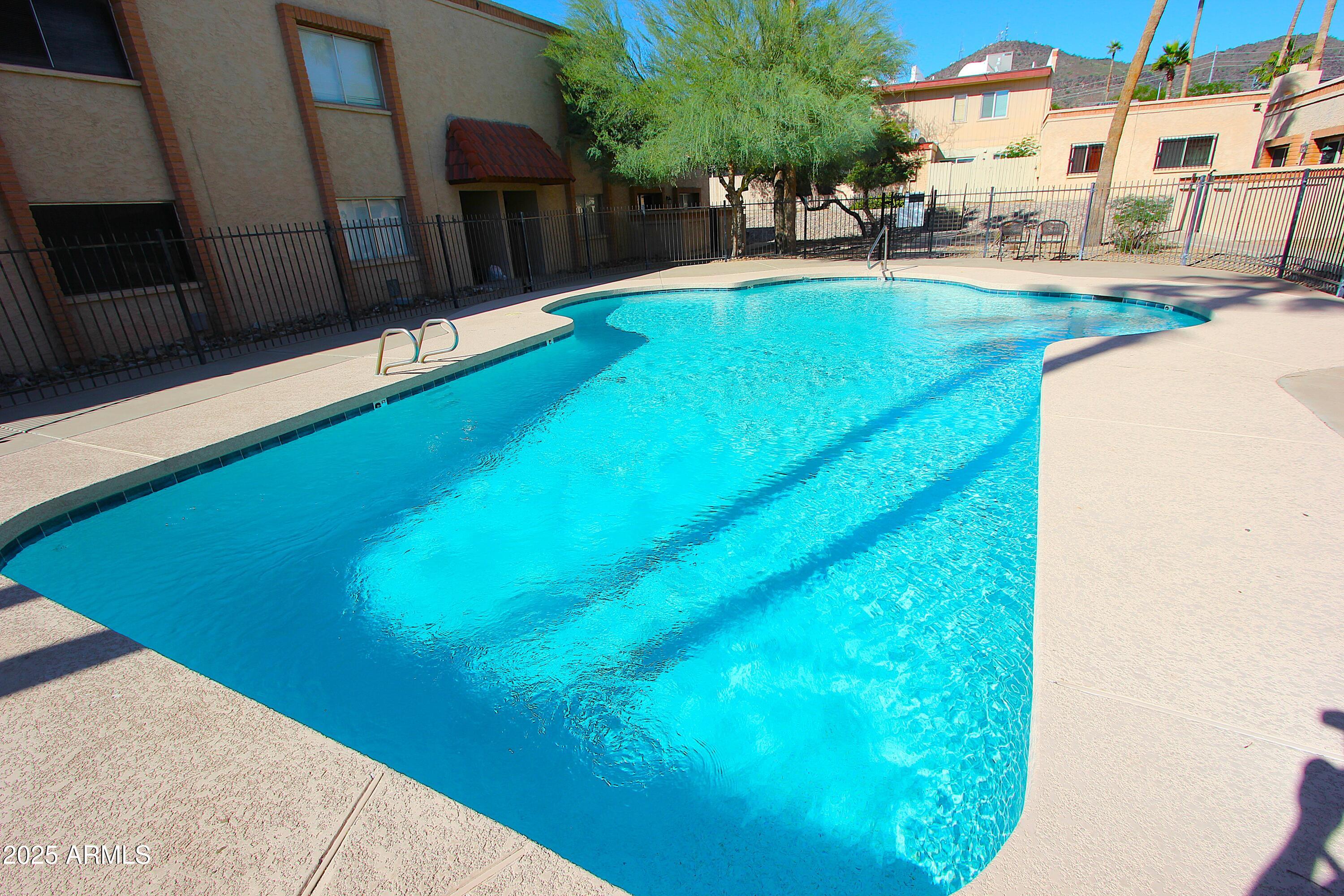 10411 North 11th Avenue, Unit 3 Phoenix, AZ 85021 - Photo 19 of 23 a view of swimming pool with a yard