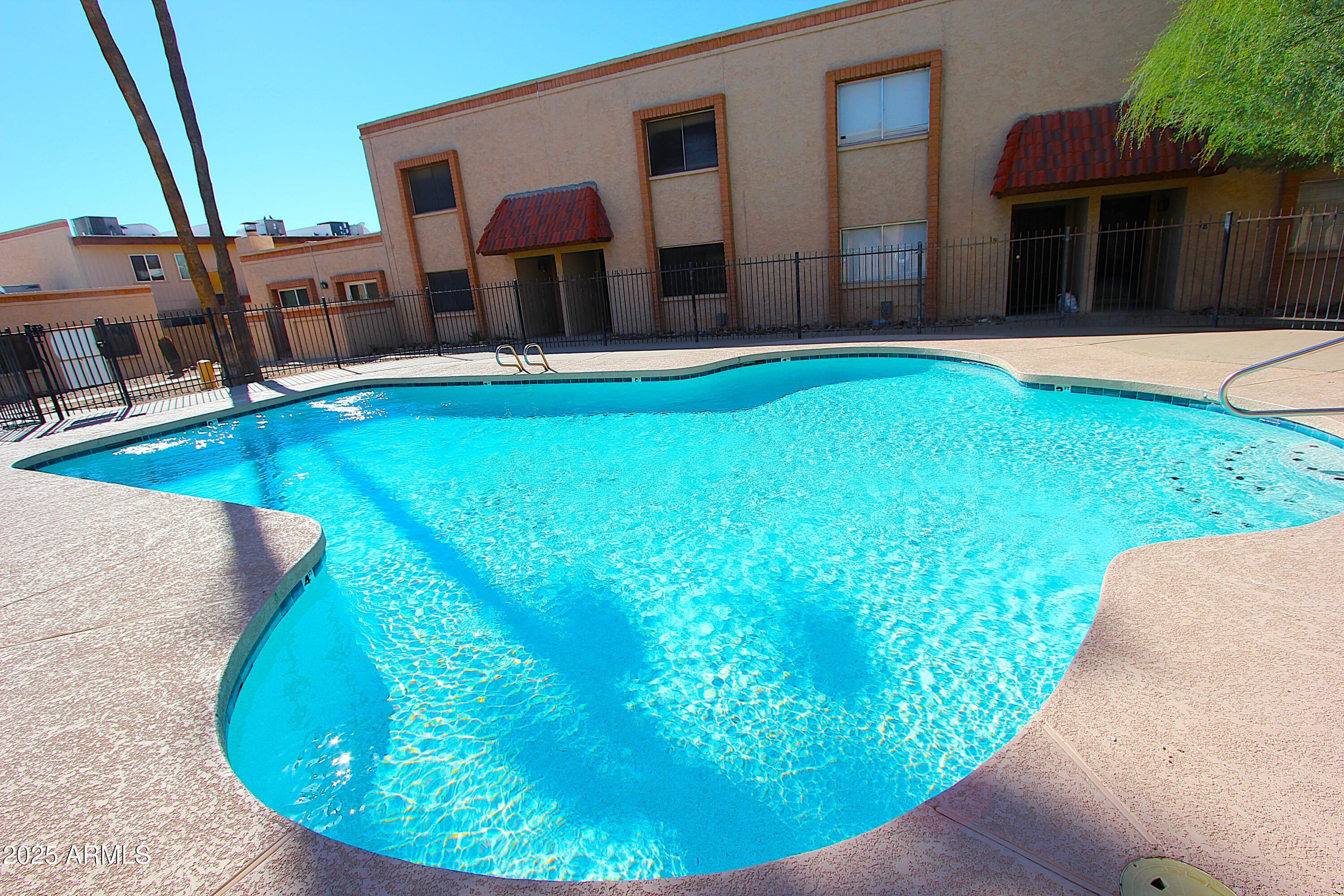 10411 North 11th Avenue, Unit 3 Phoenix, AZ 85021 - Photo 20 of 23 a view of a house with a backyard