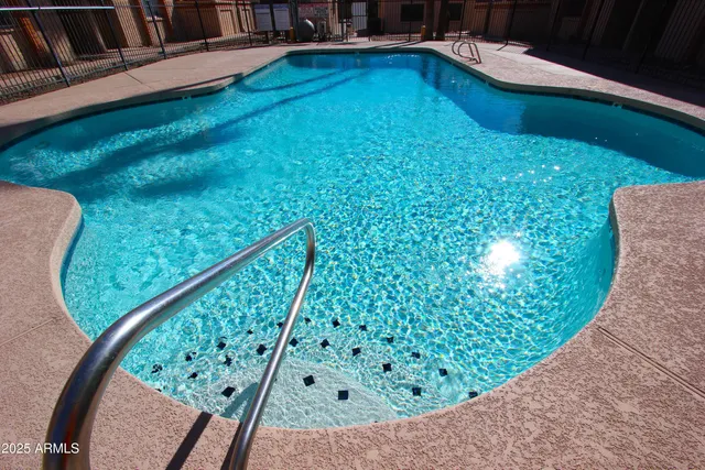 a view of a swimming pool with a porch