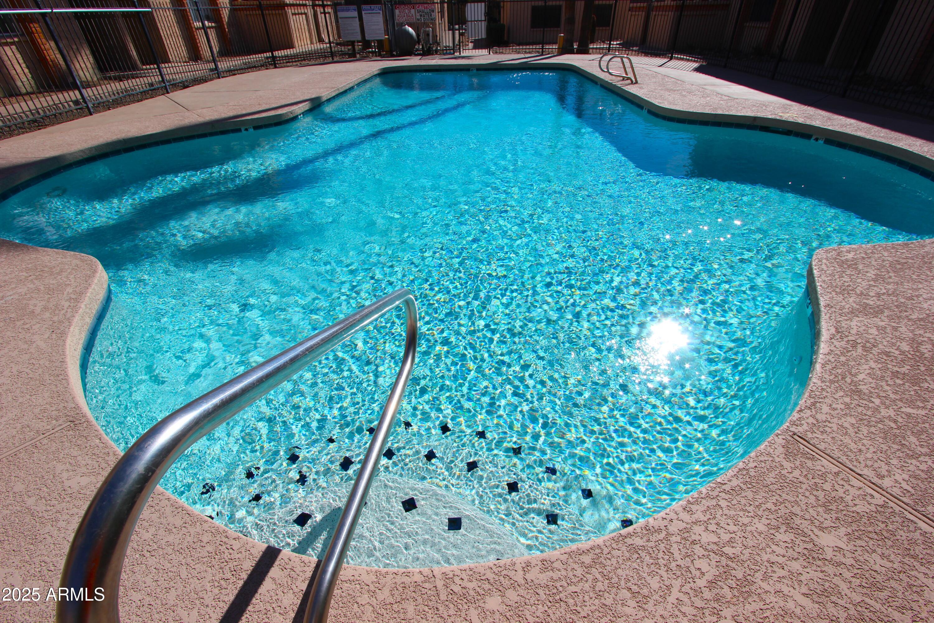 10411 North 11th Avenue, Unit 3 Phoenix, AZ 85021 - Photo 21 of 23 a view of a swimming pool with a porch