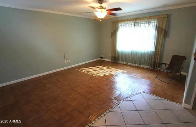 a view of an empty room and window
