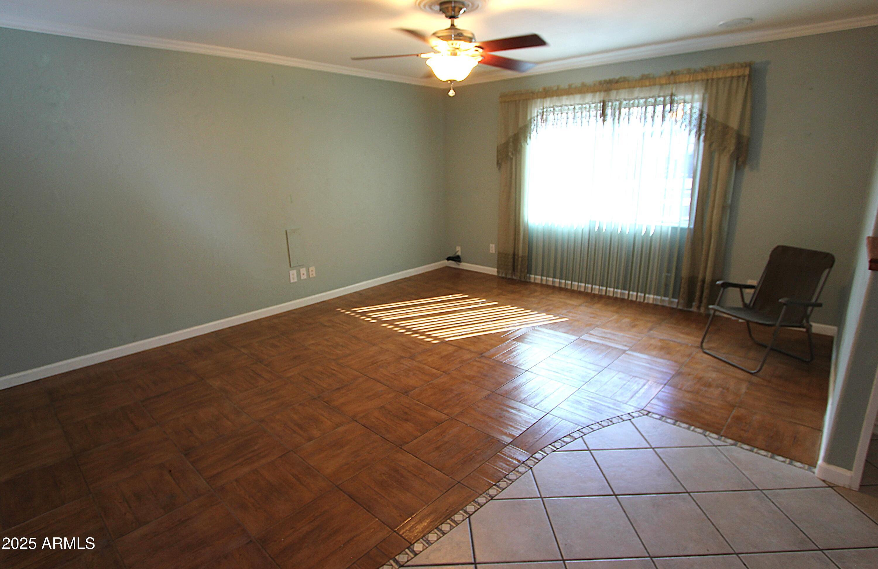 10411 North 11th Avenue, Unit 3 Phoenix, AZ 85021 - Photo 4 of 23 a view of an empty room and window