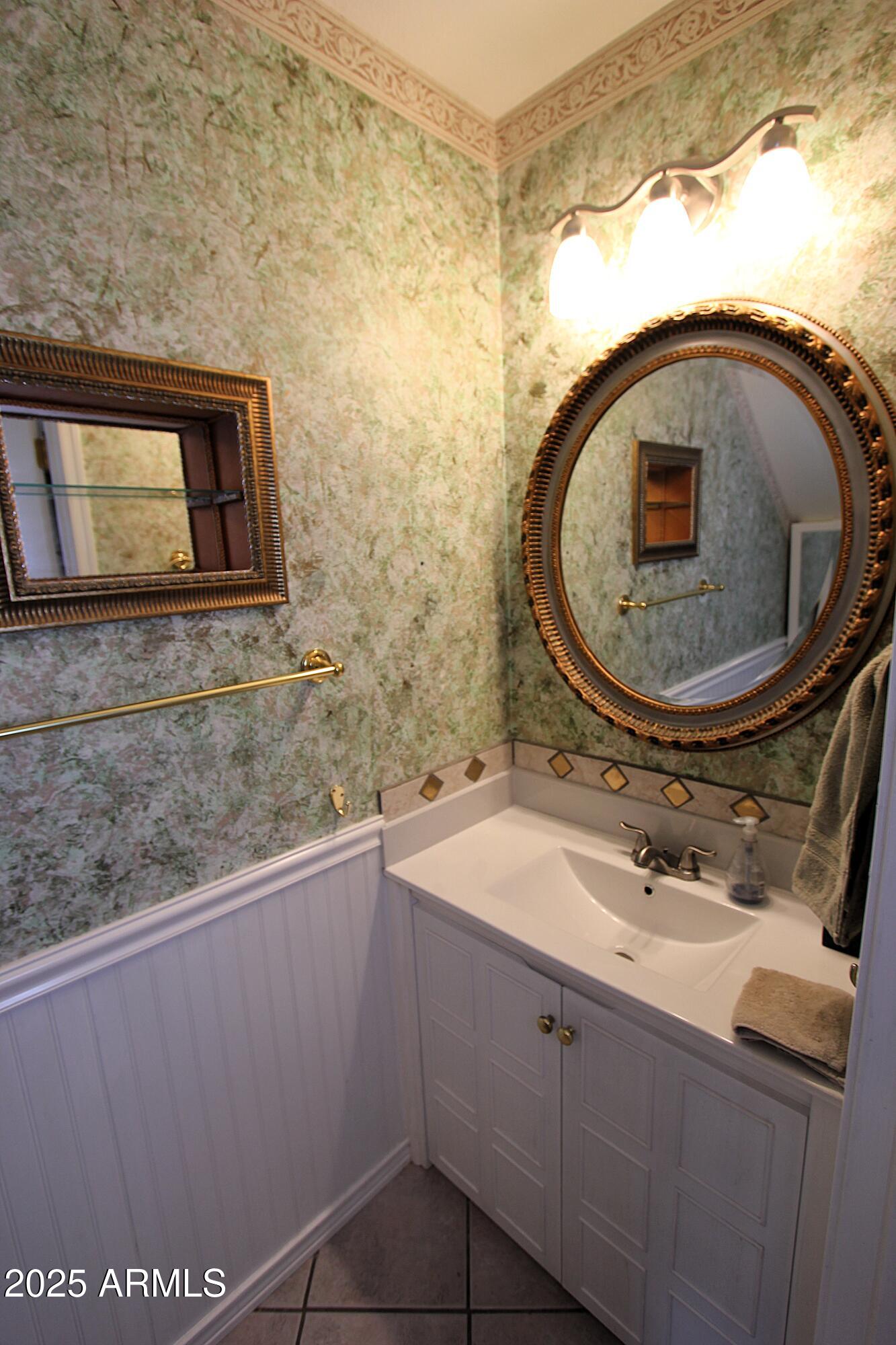 10411 North 11th Avenue, Unit 3 Phoenix, AZ 85021 - Photo 8 of 23 a bathroom with a sink and mirror